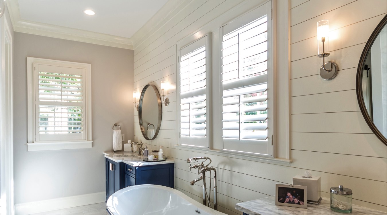 New Brunswick bathroom with white plantation shutters.