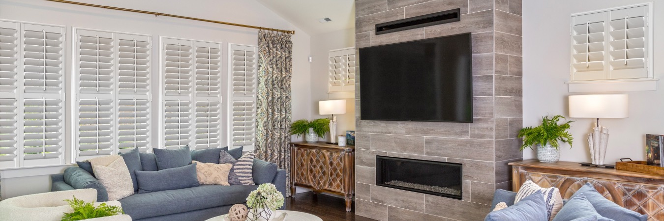 Plantation shutters in Jersey City family room with fireplace