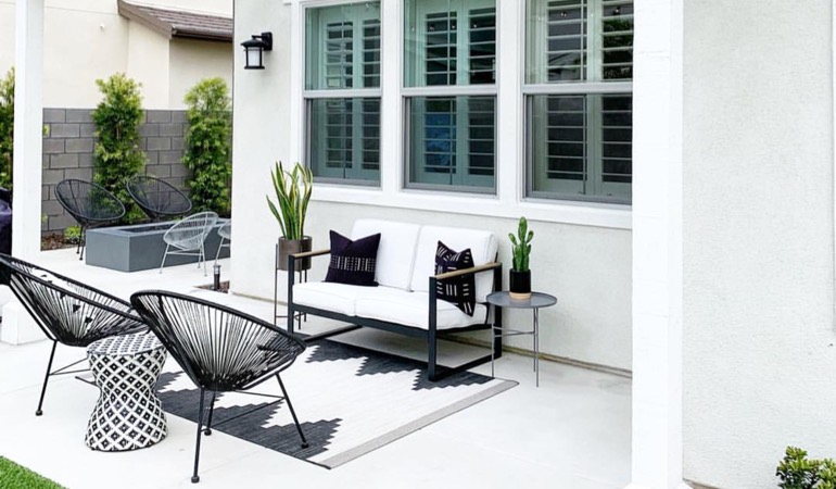 Spending a few hours weeding and mulching can help give you an outdoor oasis. Backyard with plantation shutters