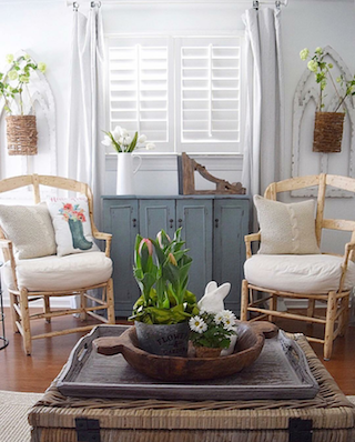 Plantation shutters in airy sunroom.