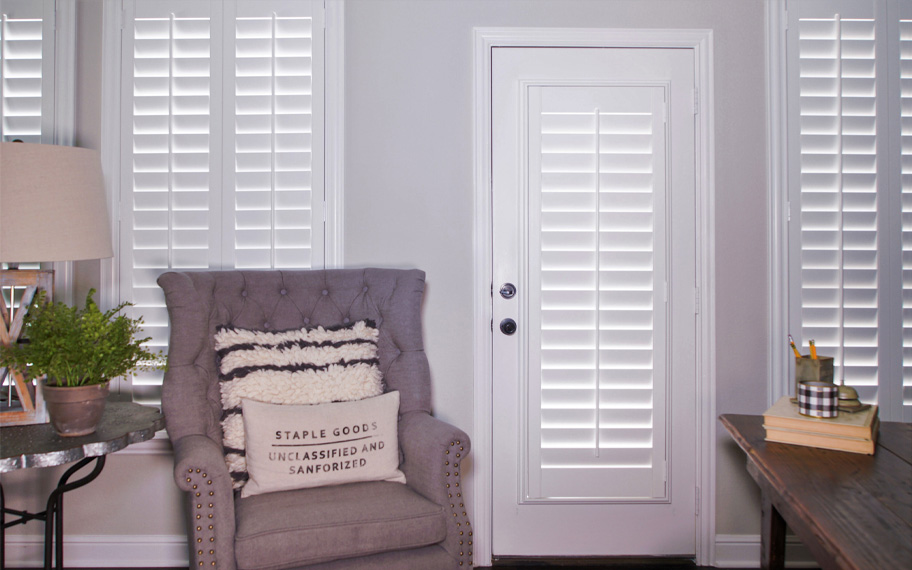 Interior shutters are beautiful and durable window treatments for glass doors in New Brunswick. Polywood shutters on a door