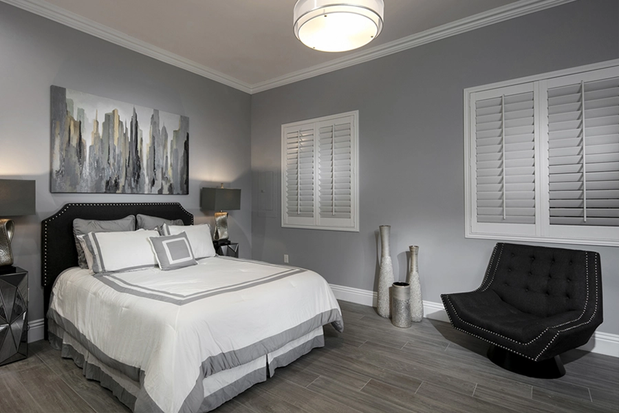Close your custom Polywood shutters to beat the heat and keep your New Brunswick bedroom cool. White Polywood shutters on bedroom windows