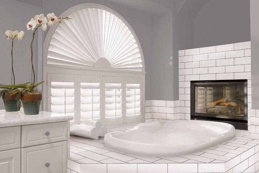 This arched plantation shutter creates a stunning focal point in this modern bathroom. Custom arched plantation shutters in bathroom.