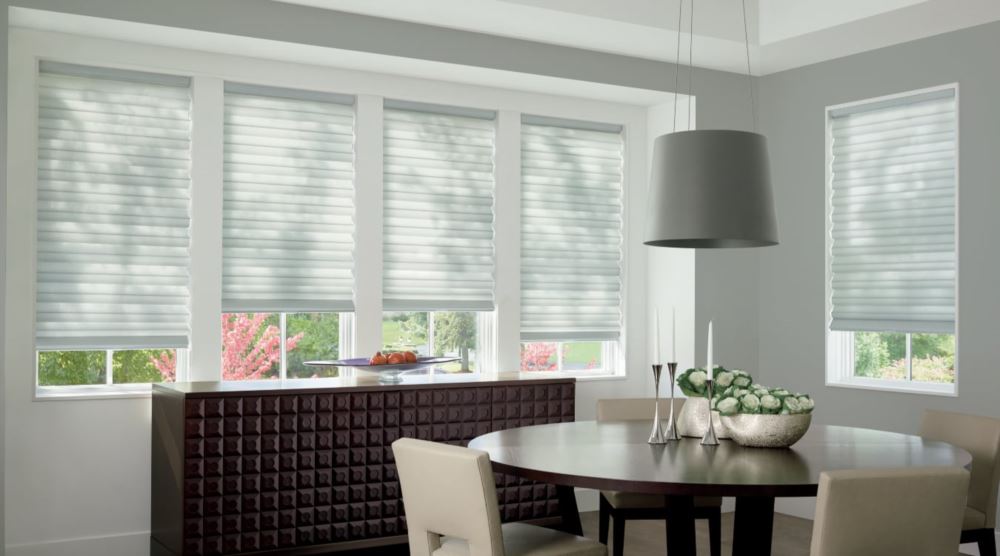 Custom cordless roller shades have a clean look and are appropriate for any room. Cordless motorized shades in a New Brunswick dining room