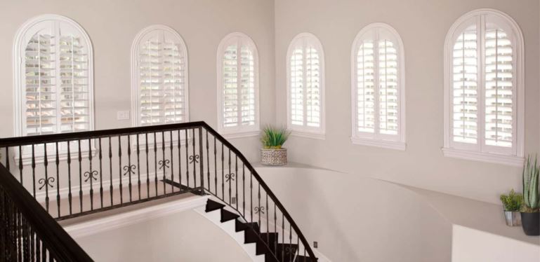 Custom-fitted window coverings perfectly cover your window without sticking out and catching on the trim. Arched Plantation Shutters