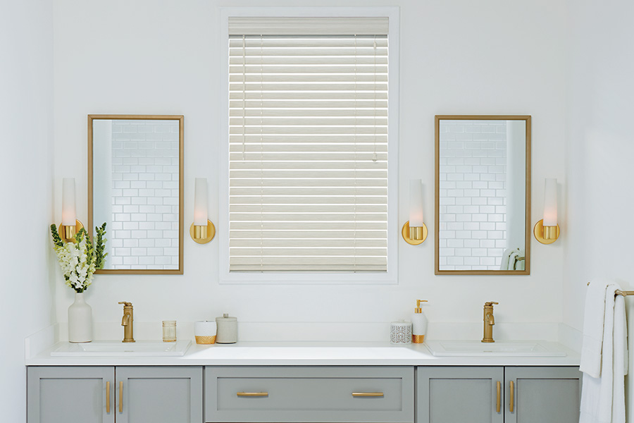 Beautiful and timeless white Polywood blinds are the perfect touch for your bathroom.  White Polywood blinds in a modern styled bathroom
