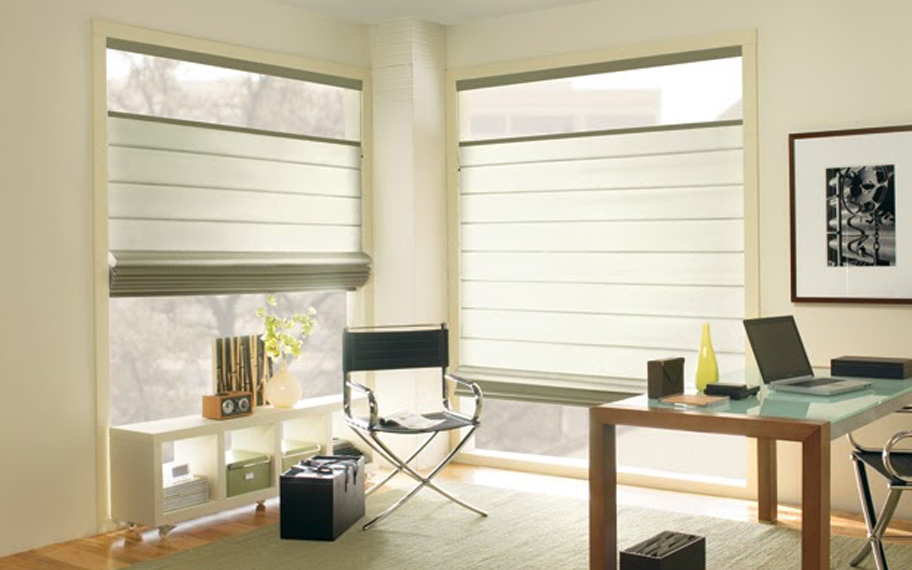 Upgrade your windows with stylish window shades or shutters in New Brunswick. Stylish sheer shades in the corner of a modern office.