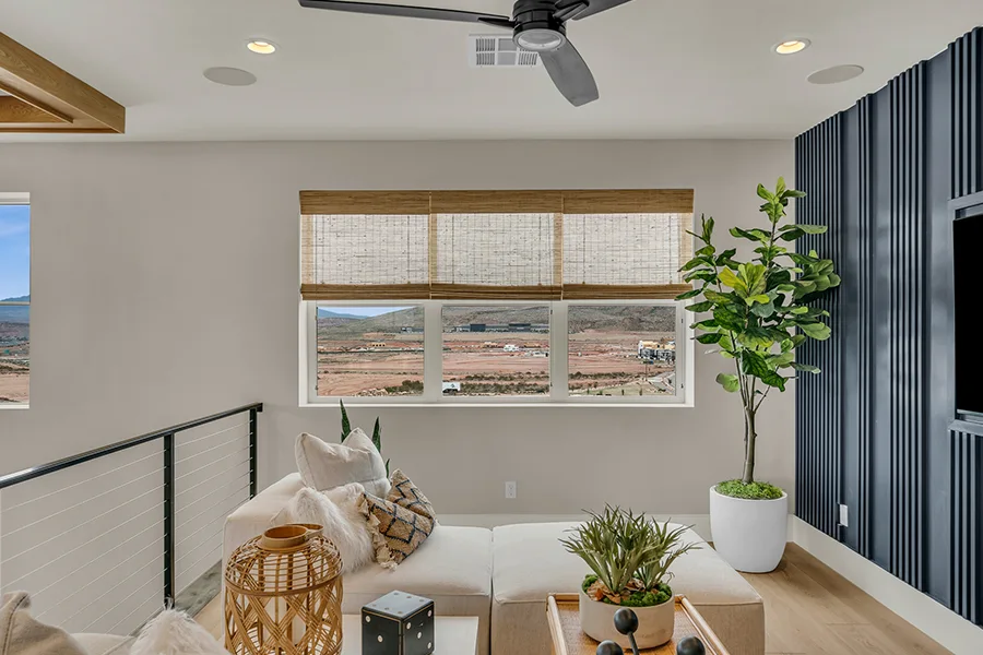 New Jersey homeowners who want eco-friendly home fixtures should consider natural woven shades. Natural brown woven shades on a window in a stylish sitting area