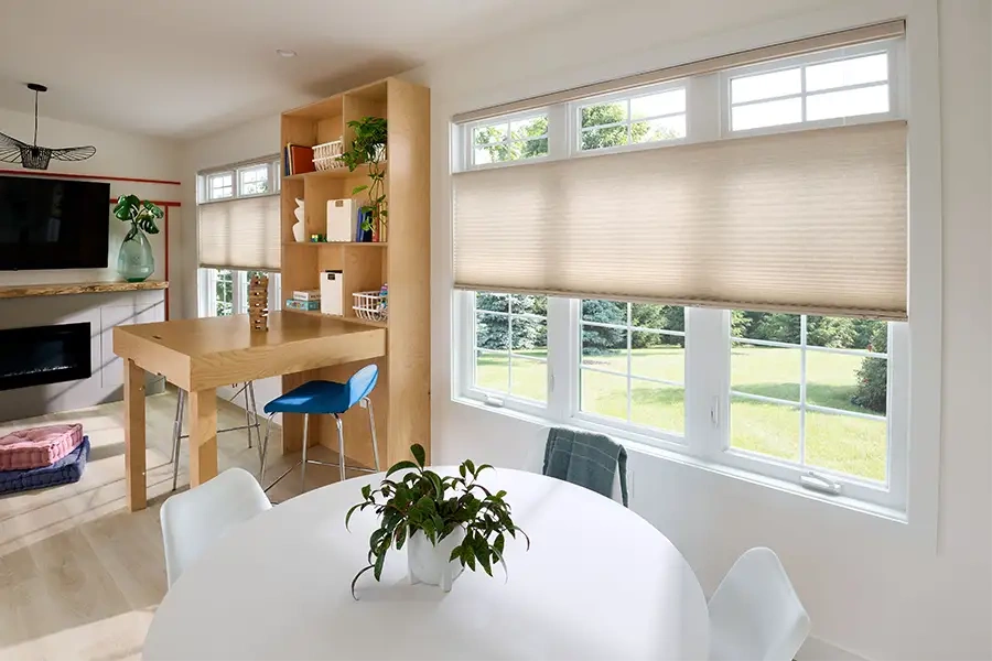 Beige cellular shades in a modern dining area