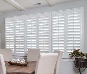 Polywood Shutters White Polywood shutters in a dining room